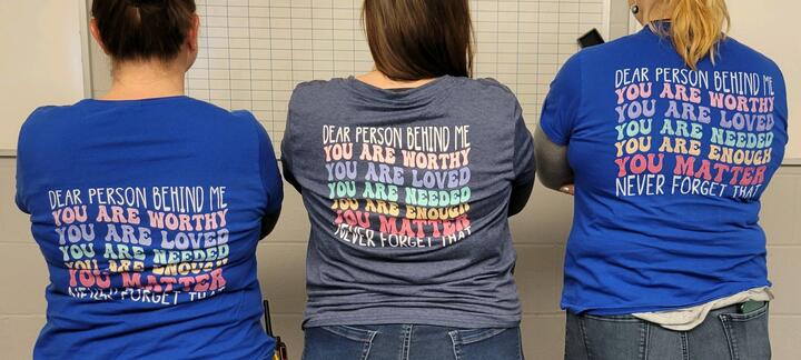 Photo of the back of School Counselors wearing inspirational T-Shirt